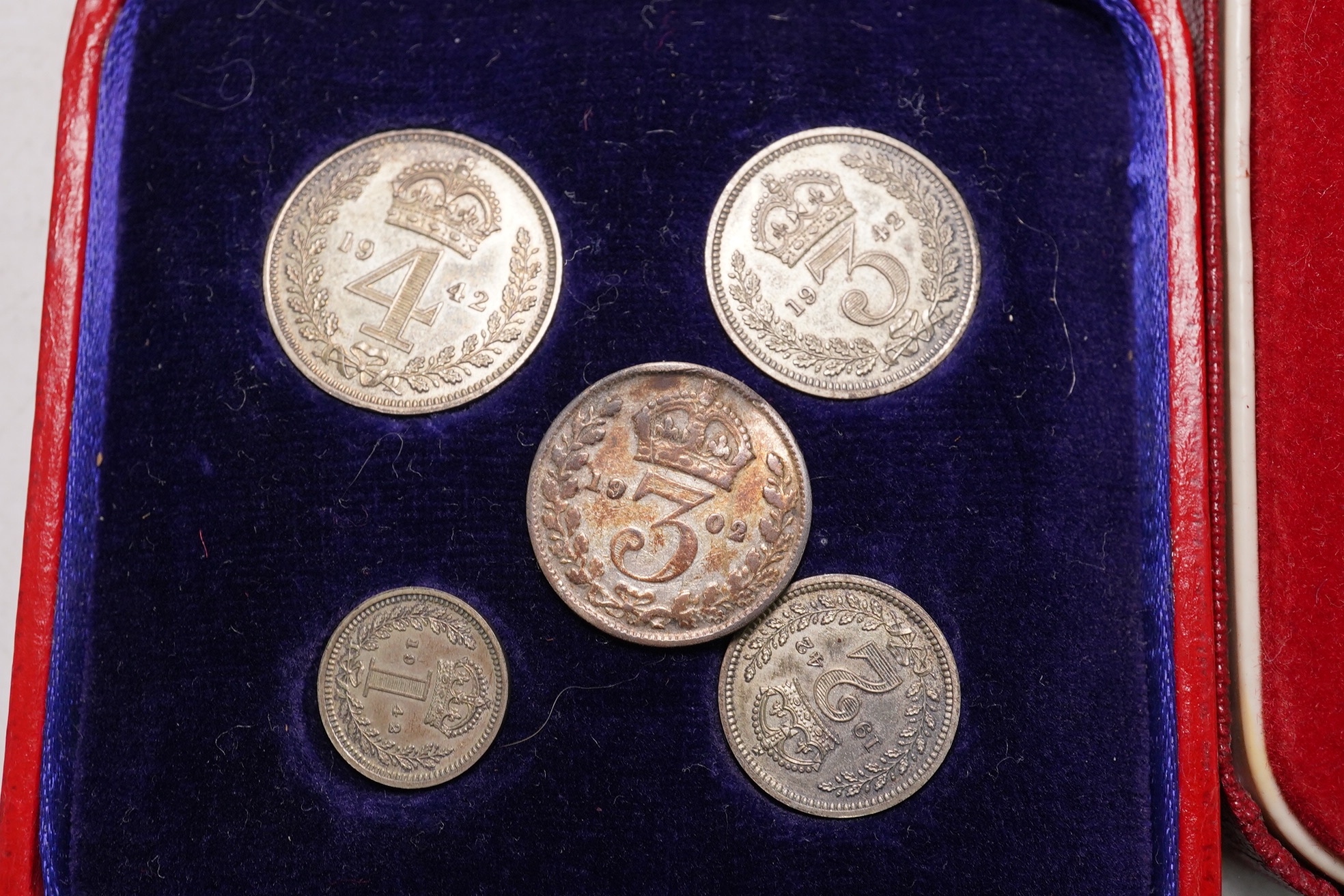 British coins, George VI, Maundy 1d to 4d, 1942, in case of issue, together with a Royal Mint silver national trust medal and other coins or medals